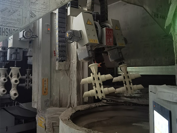 Shell making robot arm